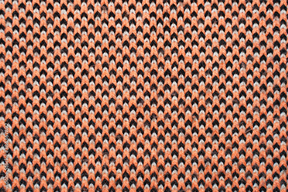 Red, white and black synthetic knitted fabric texture Red, white and black synthetic knitted fabric texture