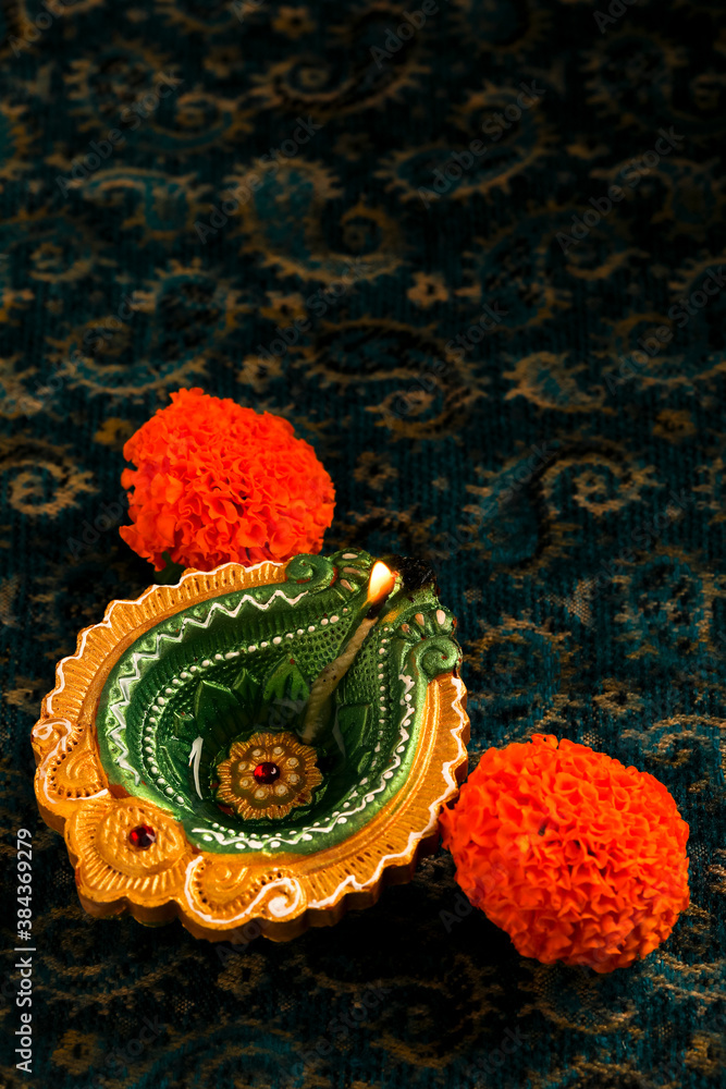 Indian Festival Diwali , oil lamp and flower on dark background