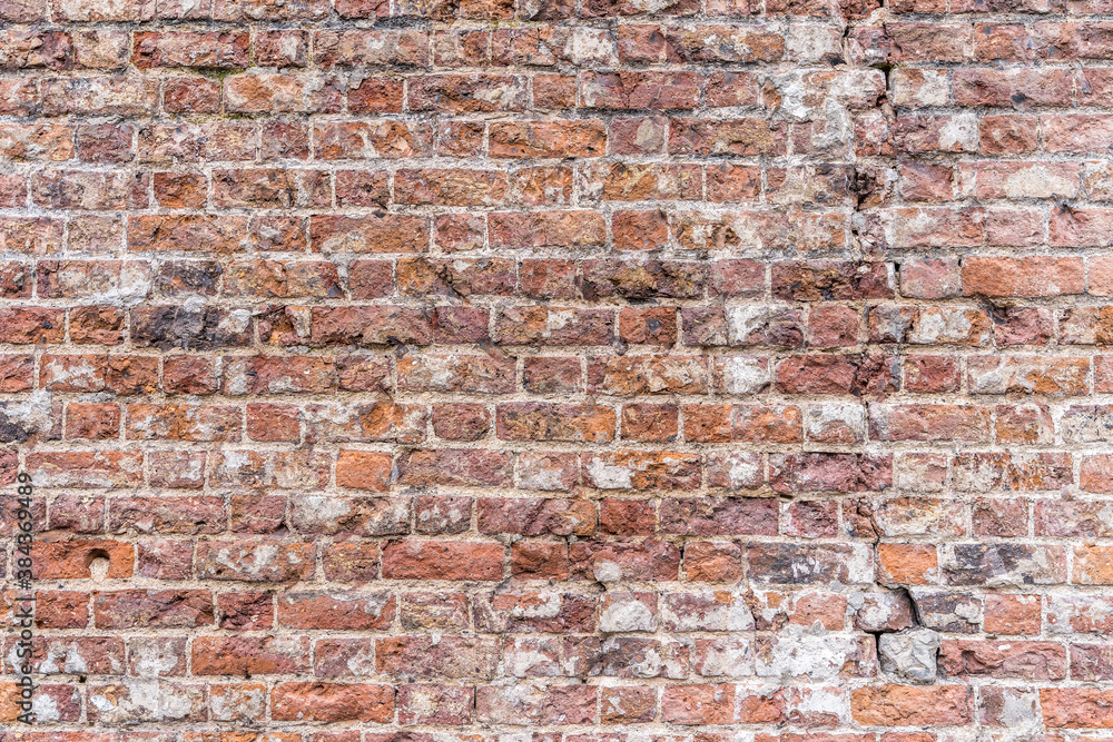 Old, rustic red corroded and damaged brick wall. High quality texture and background for your projects and creative work Old, rustic red corroded and damaged brick wall. High quality texture and background for your projects and creative work
