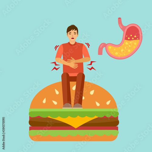 A man eat food too much and got digestion problem. He has acid reflux in stomach. Stomachache diagnosis. Healthcare concept.