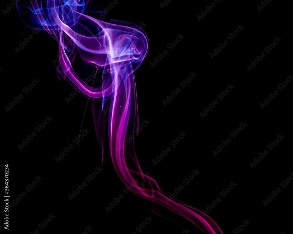 Obraz premium Colored smoke on black background