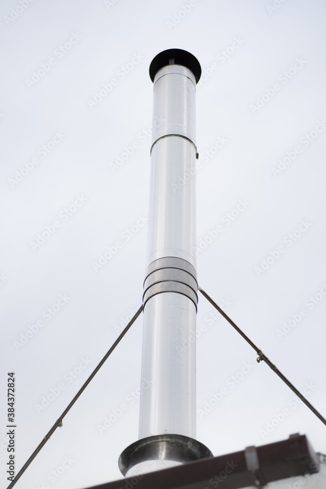 Flue pipe - a tall chimney from wood burning stove - Fossil fuels Flue pipe - a tall chimney from wood burning stove - Fossil fuels