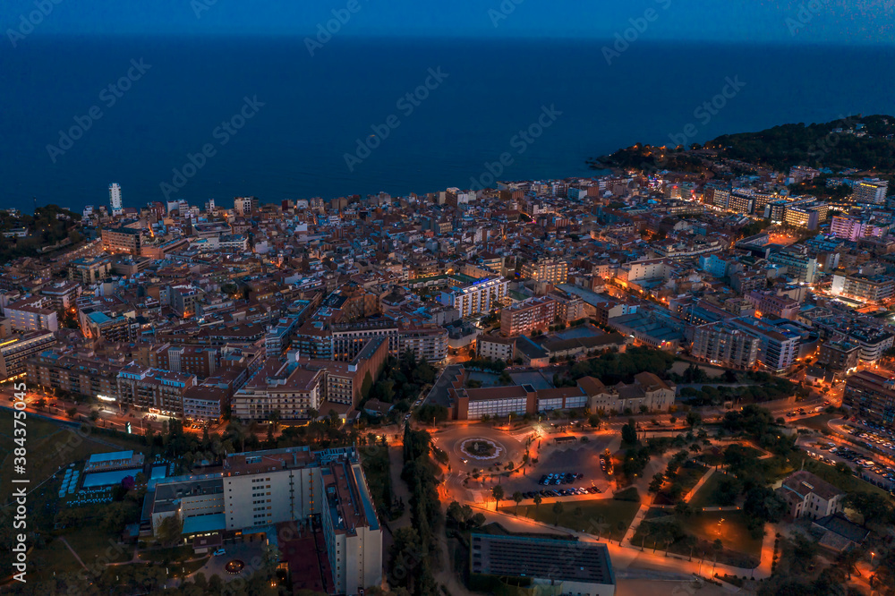 Night panorama city landscape hhe Lloret de Mar. Catalonia, Costa Brava, Spain, drone footage.