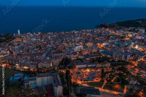 Night panorama city landscape hhe Lloret de Mar. Catalonia, Costa Brava, Spain, drone footage.