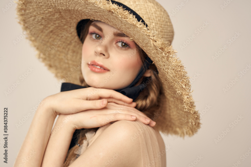 cute girl in straw hat with black ribbon and dress on beige background cropped view cute girl in straw hat with black ribbon and dress on beige background cropped view