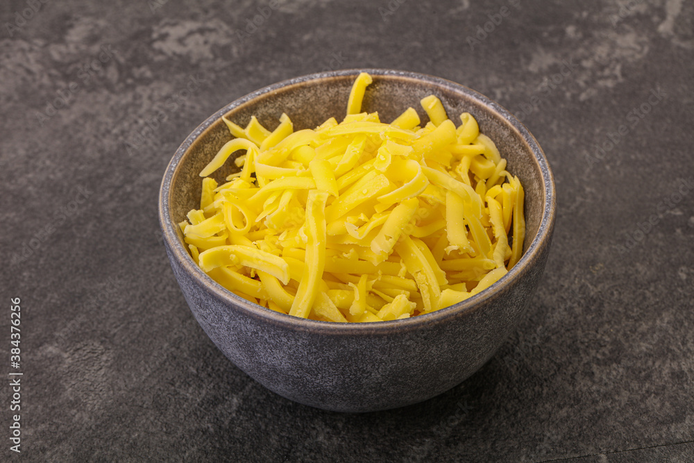 Shredded yellow cheese in the bowl Shredded yellow cheese in the bowl