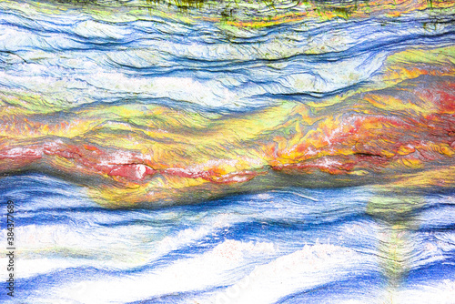 Rock layers - a colorful formations of sedimentary rocks stacked over the hundreds of years. Abstract background with fascinating texture for graphic design.