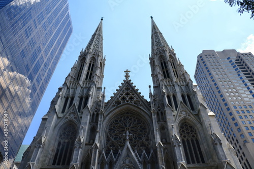 St. Patricks Cathedral located on Fifth Avenue in Manhattan. This Cathedral built in 1858 is a decorated Neo-Gothic-style cathedral church in New York, USA photo