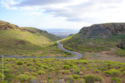 Windy road from mountains to the sea