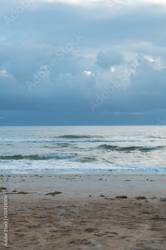 Fototapeta Naklejka Na Ścianę i Meble -  Ormond Beach at sunrise with colorful clouds sand and ocean