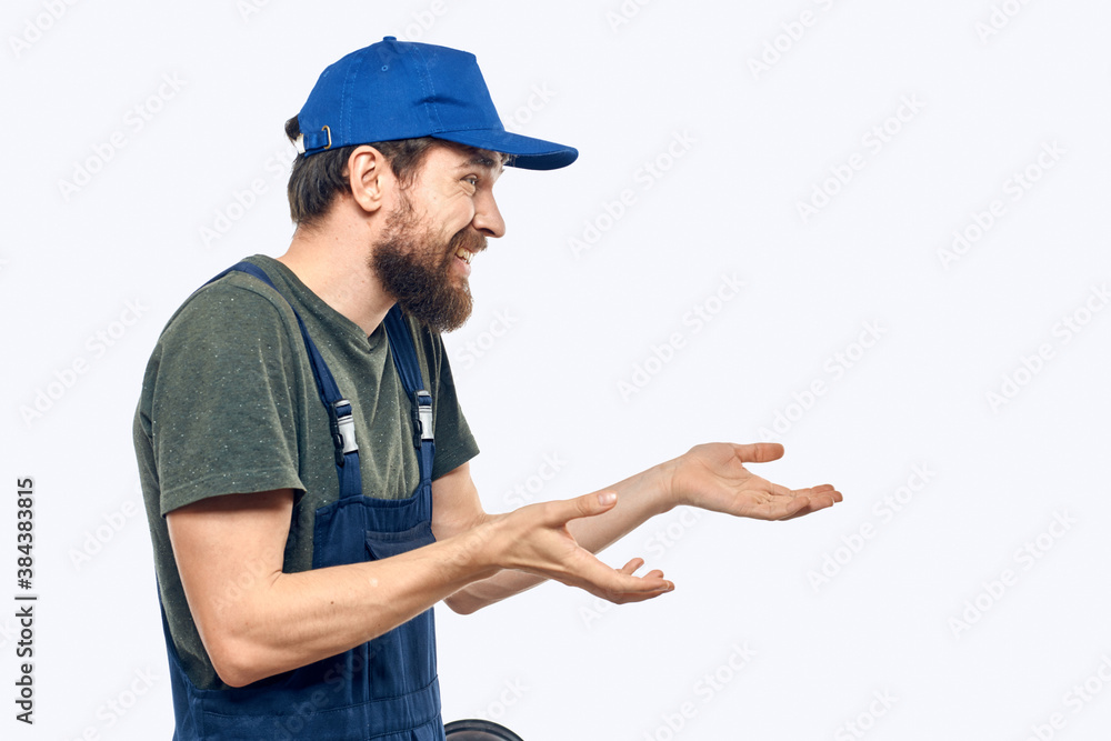 Worker man uniform delivery service emotions studio light background Worker man uniform delivery service emotions studio light background