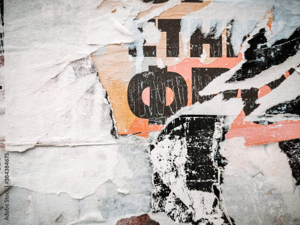 Fototapeta premium Vintage old posters stuck and torn on the wall in your grunge background