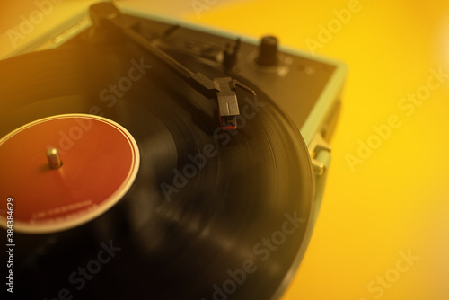 Turntable vinyl old school in yellow background - Music , artist and creativity concept