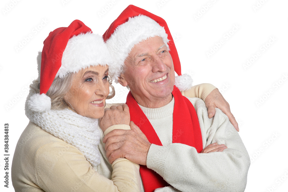 Portrait of happy senior couple in Santa hats Portrait of happy senior couple in Santa hats