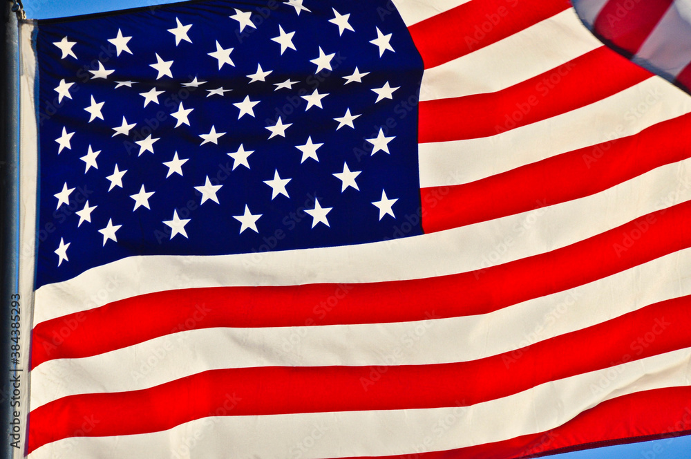 Obraz premium American Flag in full frame waving in the wind.