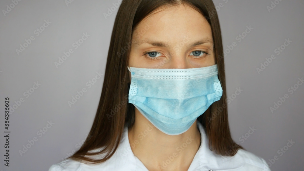 A portrait of a very beautiful nurse with a protective mask close up A portrait of a very beautiful nurse with a protective mask close up