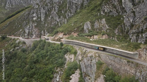 Aerial Truck on a Dangerous High Mountain Road between Rocks and Trees. Going Down. Asturias, Spain.