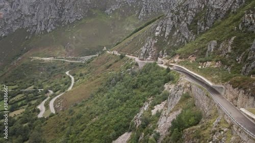 Aerial Car in a Dangerous High Mountain Road between Rocks and Trees. Going Down. Asturias, Spain.