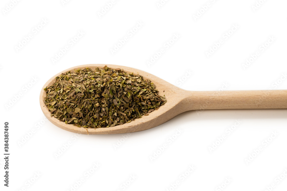 Oregano spice in wooden spoon isolated. Oregano spice in wooden spoon isolated.