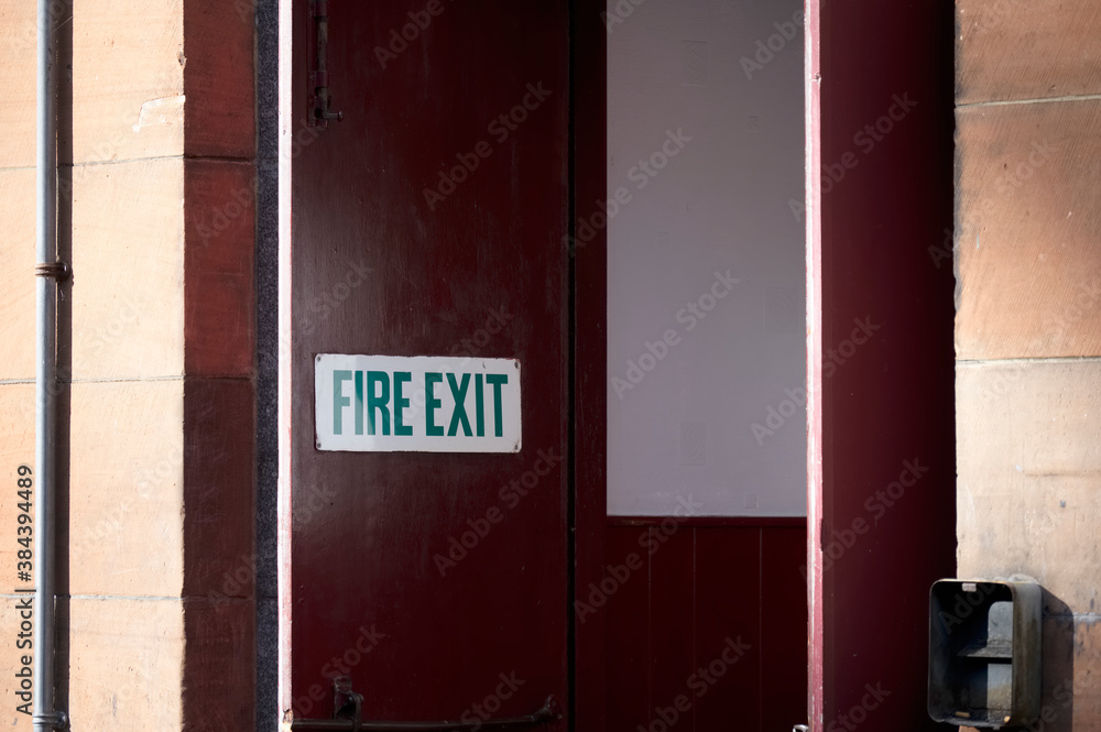 Fire exit keep clear sign on construction building site door Fire exit keep clear sign on construction building site door