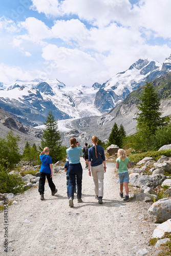 Morteratsch, Switzerland - July 22, 2020 : Tourists at Morteratsch Glacier trail