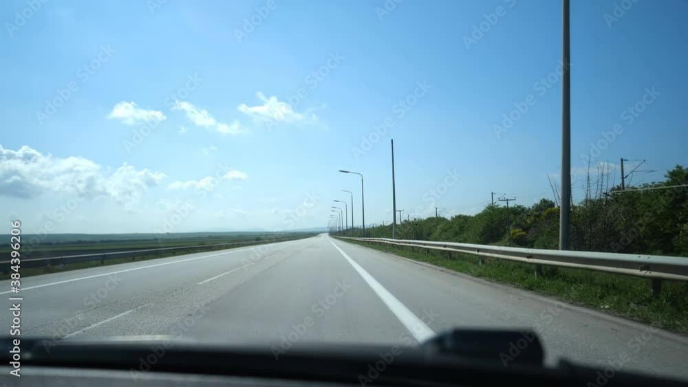 Traveling to vacation in Greece. Driving on road with light posts, pov Traveling to vacation in Greece. Driving on road with light posts, pov