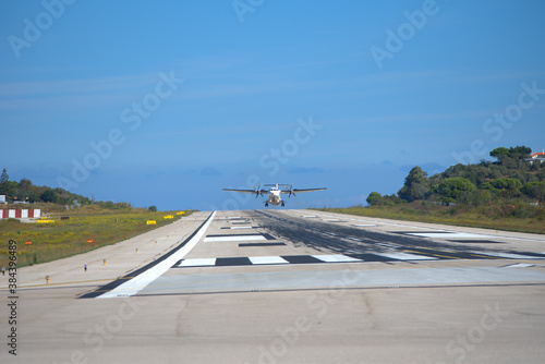plane takes off, from small airport