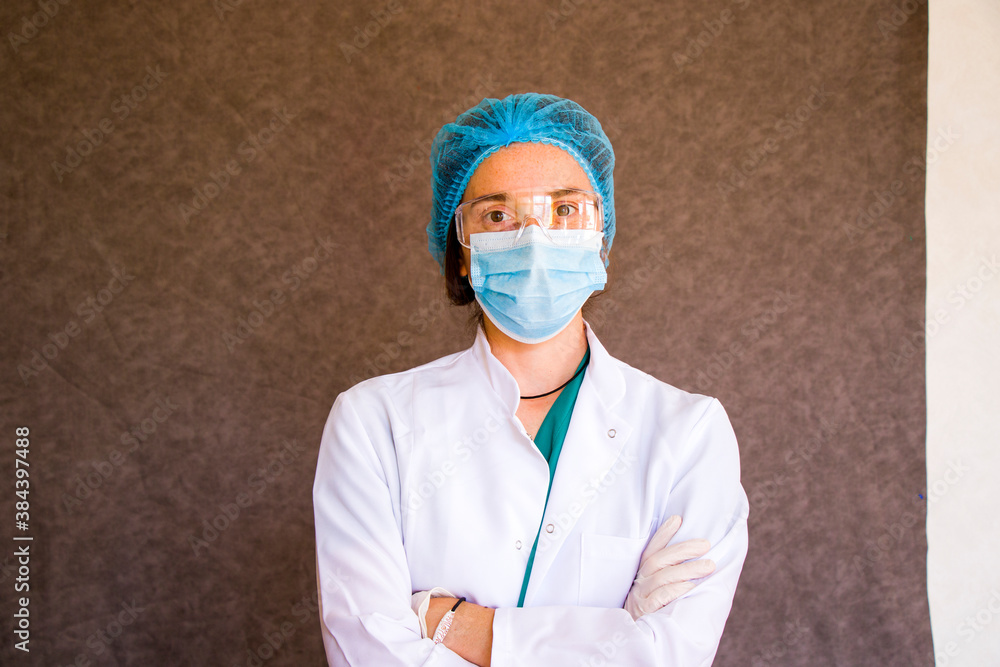 Woman doctors portrait, doctors with mask, glasses, glove and uniform. Woman doctors portrait, doctors with mask, glasses, glove and uniform.