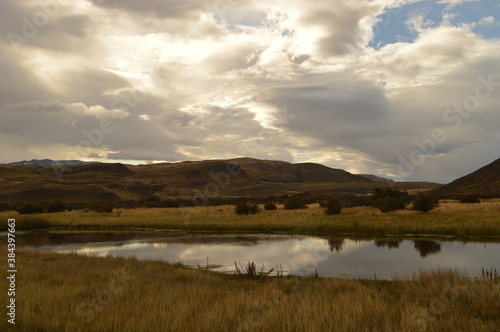 Hiking around the dramatic and windy mountain landscapes of Torres del Paine in Patagonia, Chile photo