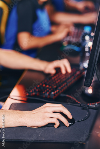 Cropped shot of a cybersport gamer playing online video games, participating in eSport tournament