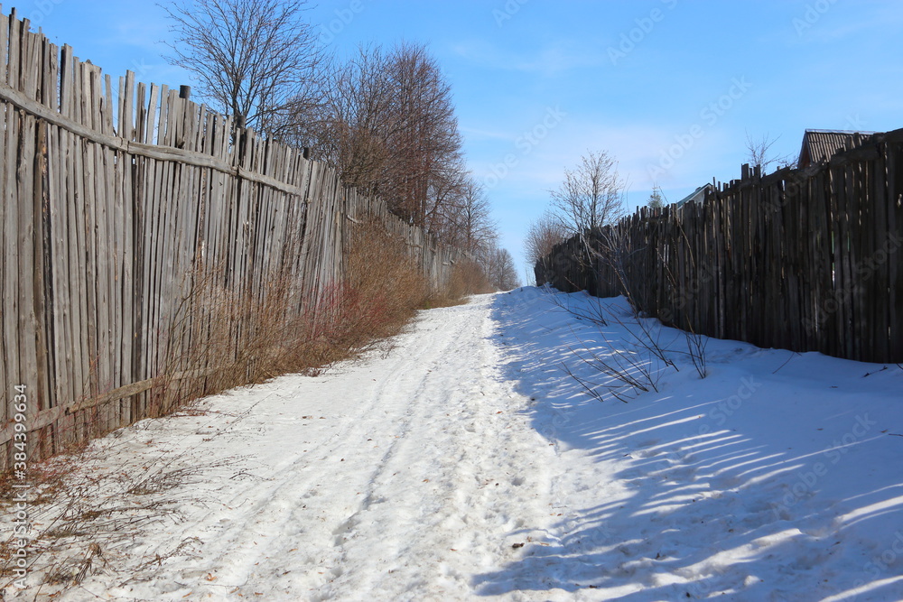 snow trail between fences in winter snow trail between fences in winter