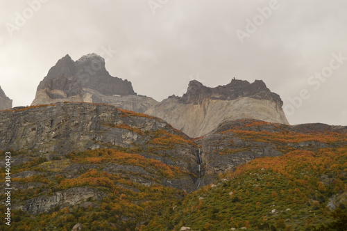 Hiking around the dramatic and windswept mountain landscapes of the Torres del Paine National Park in Patagonia, Chile photo