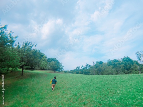 the boy running at the hill in summer © JumsiCat