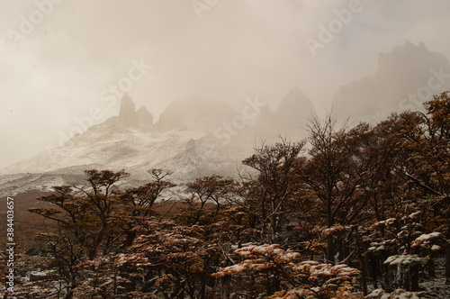 Hiking in the windy and snowy mountains of the Torres del Paine National Park in Patagonia, Chile photo