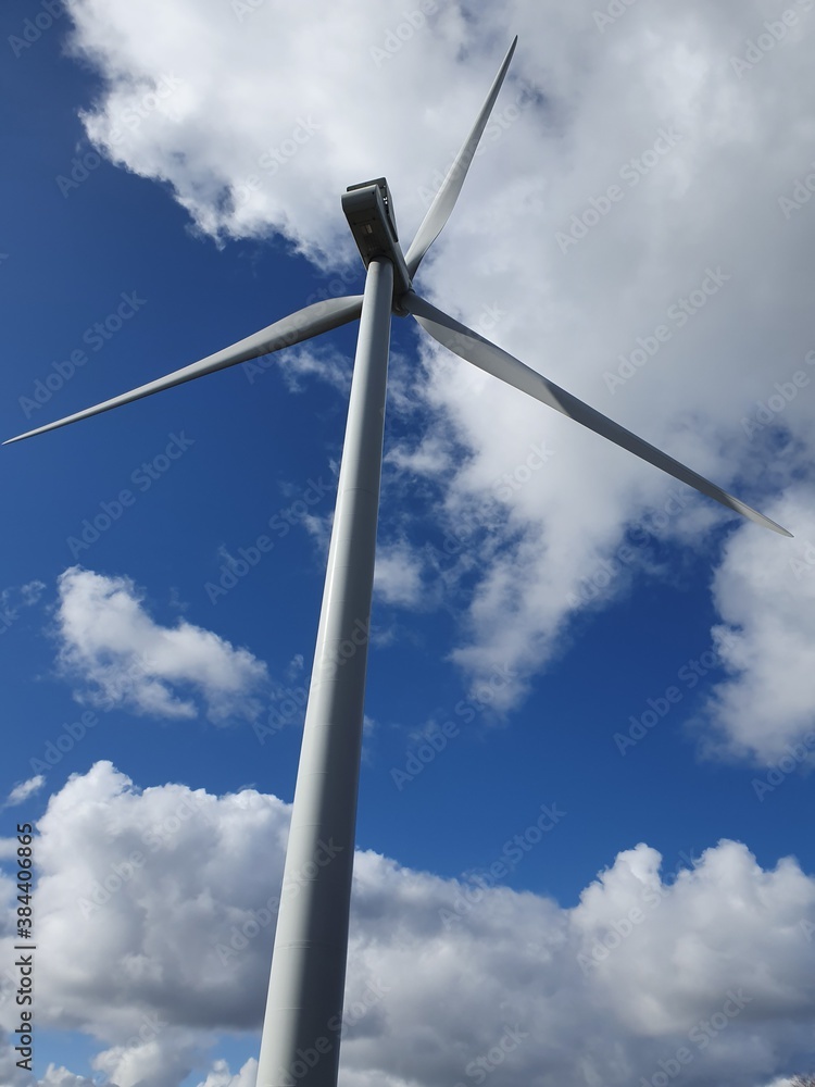 Scottish wind turbine in Fife with blue sky and clouds Scottish wind turbine in Fife with blue sky and clouds