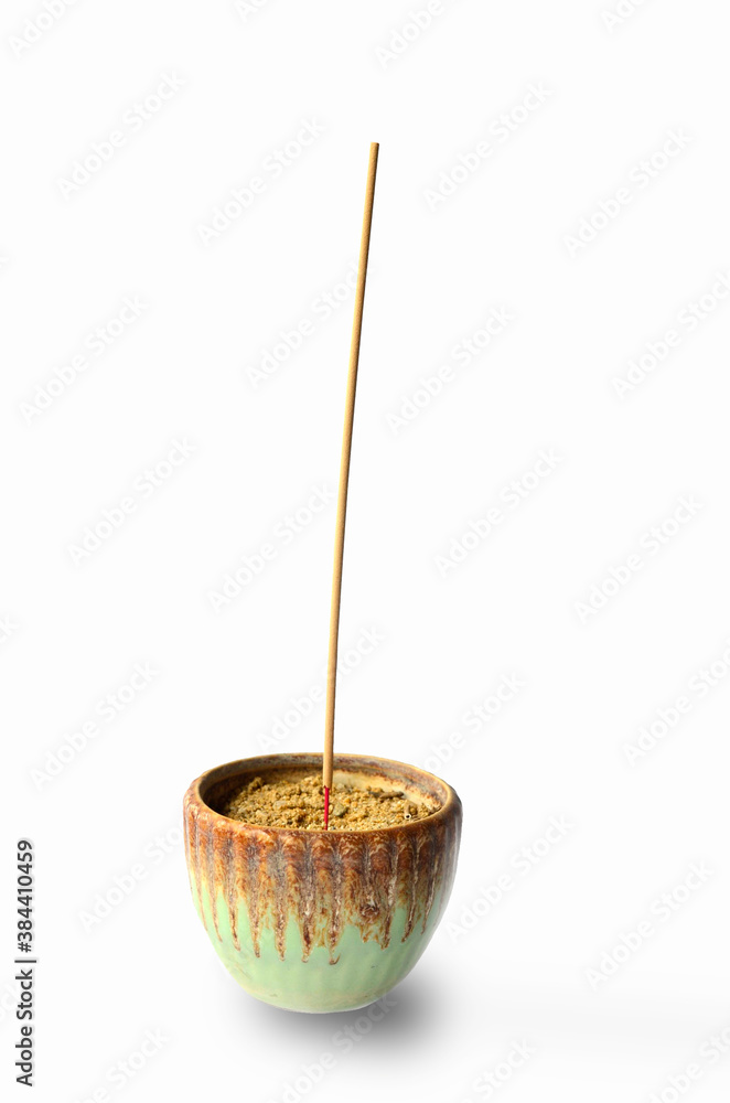Incense in an old incense burner on a white background Incense in an old incense burner on a white background