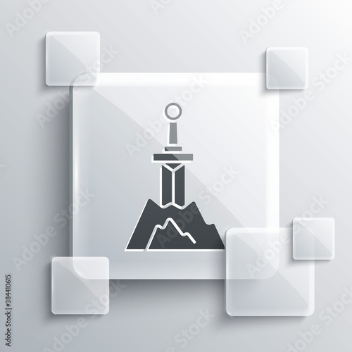 Grey Sword in the stone icon isolated on grey background. Excalibur the sword in the stone from the Arthurian legends. Square glass panels. Vector.