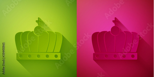 Paper cut King crown icon isolated on green and pink background. Paper art style. Vector.