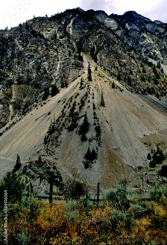 A steep well-developed active alluvial fan impacts railroad tracks that run along the base of fan, near Seton Recreation Area, British Columbia photo