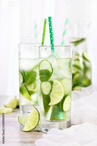 Refreshing tonic with slices of cucumber, mint, lime