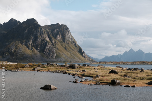 Uninhabited Lofoten Islands during Covid-19 pandemic situation in autumn. No tourists and very quiet and peaceful fall mood and beautiful colors. Ocean view and spectacular mountains at the back. 