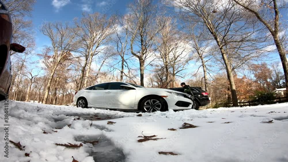 time lapse woman cleaning the car after the first snow fall of the season in November time lapse woman cleaning the car after the first snow fall of the season in November