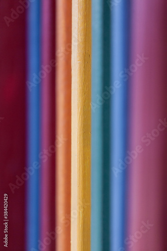 Raiinbow color wooden fence rails photo