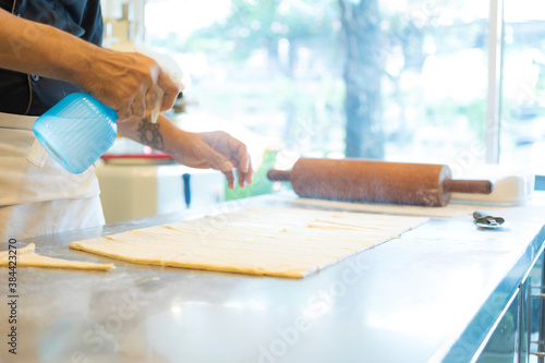 Hands baking dough with rolling pin on wooden table Hand, Cooking, Dough, Bread, Bakery,Croissant 