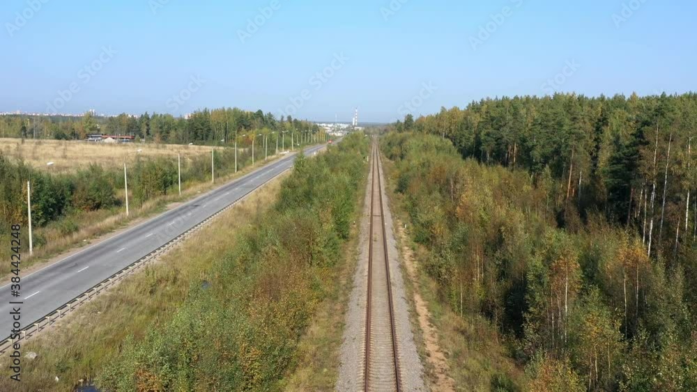 Railway through autumn forest. Aerial view from copter Railway through autumn forest. Aerial view from copter