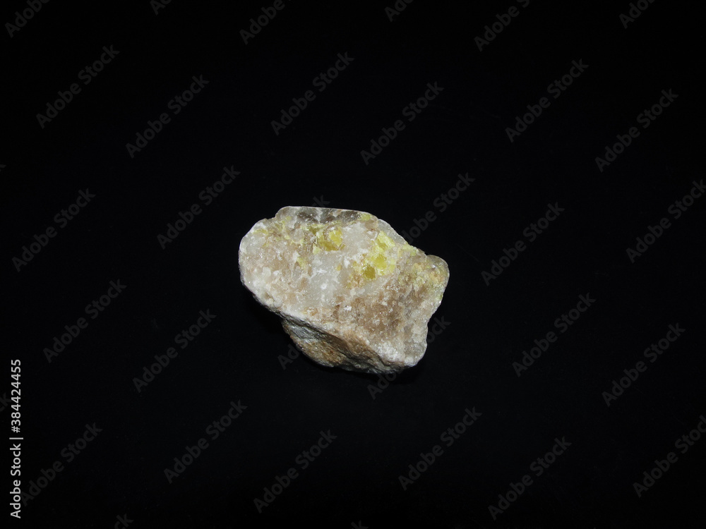 sample of native sulfur in dolomite on a black background sample of native sulfur in dolomite on a black background
