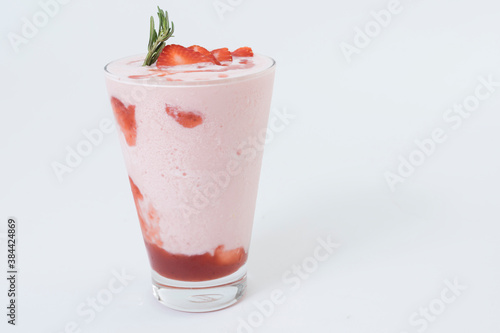 Strawberry smoothie or milkshake on white background