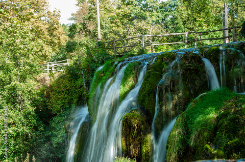 Waterfall in the with green background