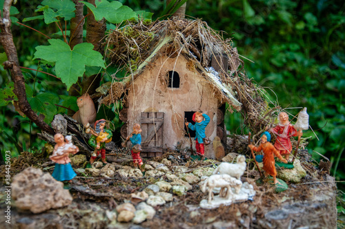 Doll house with colorful figurines