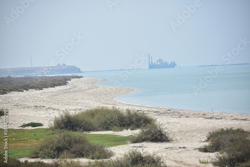 View of a sand dragger boat anchored on a seashore.Abu Dhabi,UAE.10.10.2020.